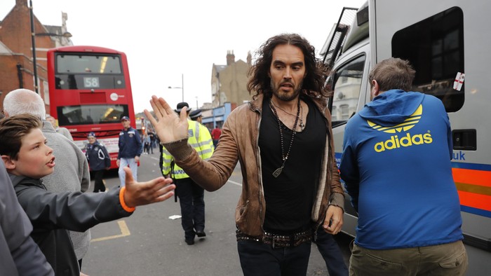 West Ham fan Russell Brand runs to the stadium before the match Reuters / Eddie Keogh
