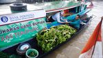 Peredaran dan Penukaran Uang di Pasar Terapung