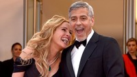 Julia Roberts dan George Clooney terlihat sumringah. Clemens Bilan/Getty Images/detikFoto.