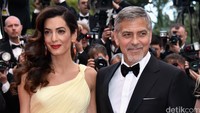 Seluruh perhatian tertuju pada pasangan George Clooney dan Amal di acara yang digelar di Palais des Festivals, Cannes, Prancis, Kamis (12/5/2016) waktu setempat. Pascal Le Segretain/Getty Images/detikFoto.