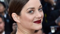 Bibirnya dipoles lipstik merah. Pascal Le Segretain/Getty Images/detikFoto.