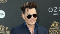 Ia tampil dengan gaya rambut yang berantakan. Frederick M. Brown/Getty Images/detikFoto.