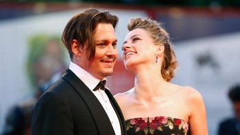 Amber Heard saat masih akur bersama Johnny Depp. Foto: Tristan Fewings/Getty Images