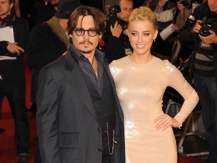 Johnny Depp and Amber Heard LONDON, UNITED KINGDOM - NOVEMBER 03: Johnny Depp and Amber Heard attend The UK Premiere of The Rum Diary at on November 3, 2011 in London, England. (Photo by Stuart Wilson/Getty Images)