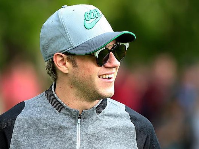 Niall Horan STRAFFAN, IRELAND - MAY 19: Singer Niall Horan looks on during the first round of the Dubai Duty Free Irish Open Hosted by the Rory Foundation at The K Club on May 19, 2016 in Straffan, Ireland. (Photo by Andrew Redington/Getty Images)