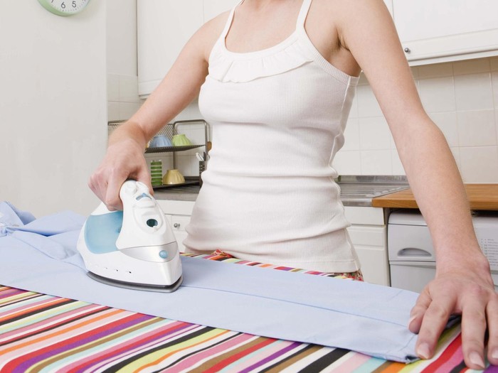 Woman ironing laundry