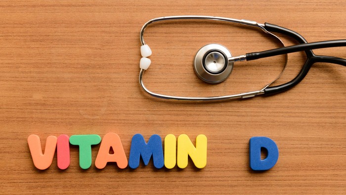 Vitamin D  colorful word on the wooden background