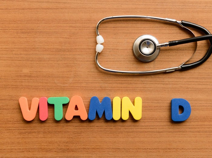 481743716 Vitamin D colorful word on the wooden background
