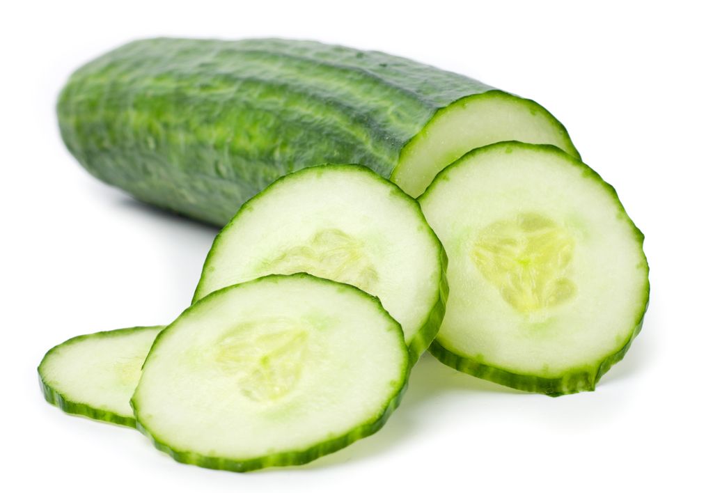 Cucumber and slices isolated over white background.