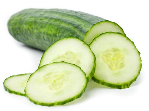 Cucumber and slices isolated over white background.