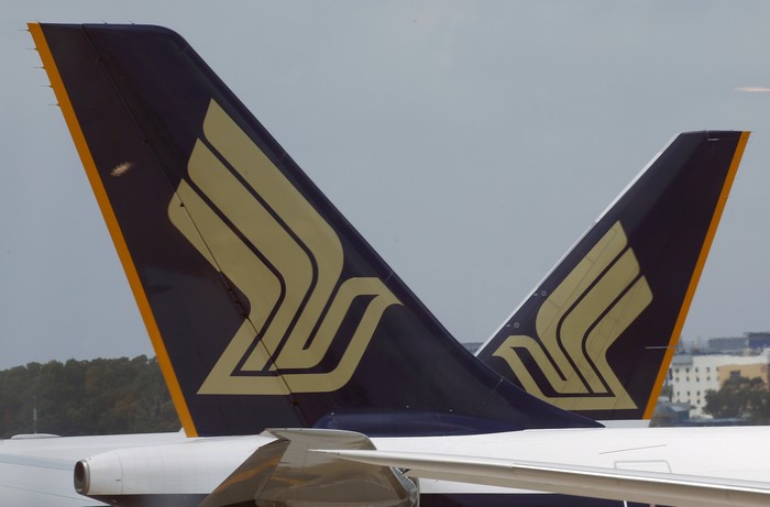 FILE PHOTO - Singapore Airlines (SIA) planes sit on the tarmac in Singapores Changi Airport March 3, 2016. REUTERS/Edgar Su/File Photo