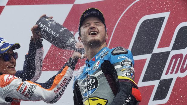 ASSEN, NETHERLANDS - JUNE 26:  Marc Marquez (L) of Spain and Repsol Honda Team sprays champagne at Jack Miller of Australia and Marc VDS Racing Team that celebrates on the podium his first victory on the MotoGP race at the end of the MotoGP race during the MotoGP Netherlands - Race at  on June 26, 2016 in Assen, Netherlands.  (Photo by Mirco Lazzari gp/Getty Images)