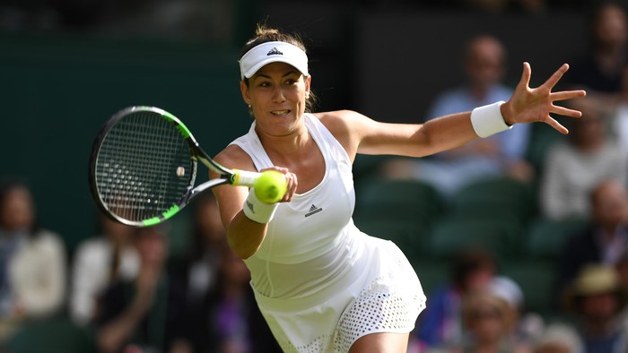 LONDON, ENGLAND - JUNE 27:  Gabrine Muguruza of Spain plays a forehand shot during the Ladies Singles first round match against Camila Giorgi of Italy on day one of the Wimbledon Lawn Tennis Championships at the All England Lawn Tennis and Croquet Club on June 27th, 2016 in London, England.  (Photo by Shaun Botterill/Getty Images)
