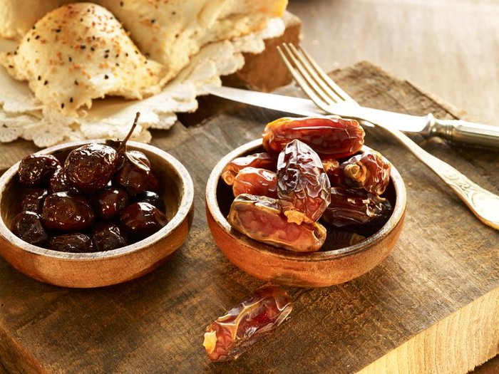 Kurma Ramazan meal with date, olives and pita bread