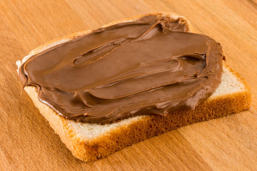 Chocolate cream toast over wood table. Dark chocolate cream sandwich