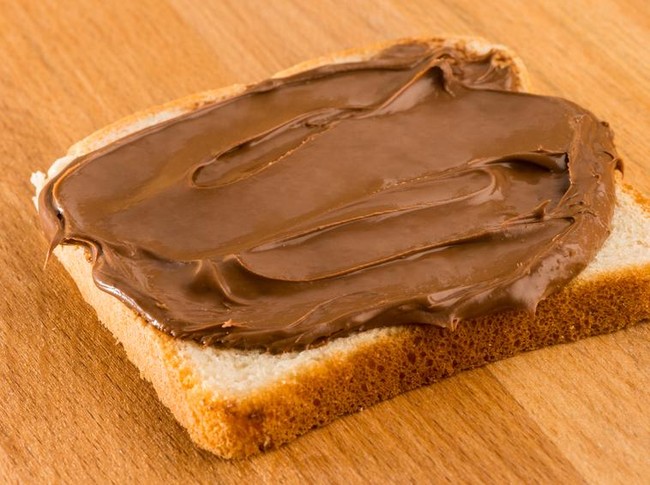 Chocolate cream toast over wood table. Dark chocolate cream sandwich