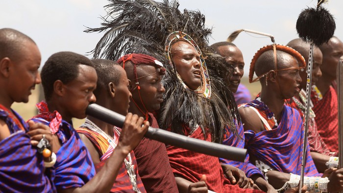 ARUSHA, TANZANIA - NOVEMBER 09:  Maasai men prepare to greet Camilla, Duchess of Cornwall and Prince Charles, Prince of Walesas they visit  Majengo Maasai Boma on November 9, 2011 in Arusha, Tanzania. The Prince of Wales and the Duchess of Cornwall are on the final day of a four day tour of Tanzania after a successful trip to South Africa. The Royal couple will be highlighting environmental and social issues during their visit to Africa.  (Photo by Chris Jackson/Getty Images)