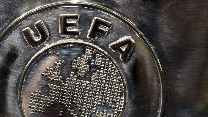 NYON, SWITZERLAND - JULY 18: The UEFA logo is seen on the UEFA Champions League trophy as it is prepared for the UEFA 2014/15 Champions League third qualifying rounds draw at the UEFA headquarters, The House of European Football, on July 18, 2014 in Nyon, Switzerland. (Photo by Harold Cunningham/Getty Images for UEFA)