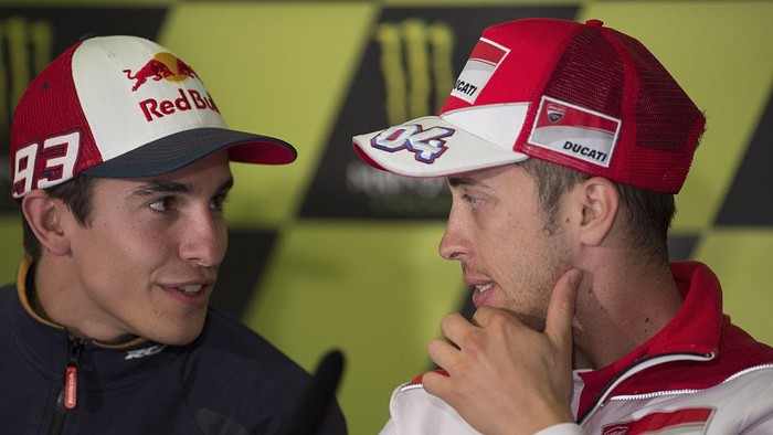 PARIS, FRANCE - MAY 14:   Andrea Dovizioso of Italy and Ducati Team speaks with Marc Marquez of Spain and Repsol Honda Team (L) during the MotoGp of France - Press Conference at  on May 14, 2015 in Paris, France.  (Photo by Mirco Lazzari gp/Getty Images)