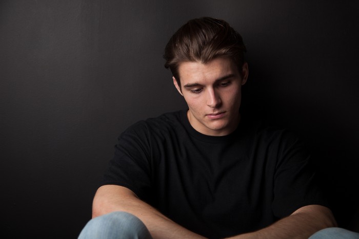Teenage boy feeling sad or depressed