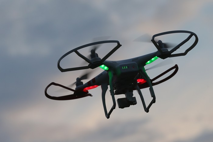 BRUECK, GERMANY - JUNE 08:  The photographers DJI Phantom 3 Pro multirotor drone flies near a wind farm on June 8, 2016 near Brueck, Germany. Countries across Europe are debating legislation to regulate the use of consumer drones. As prices have come down and piloting simplified the market for consumer-oriented drones has risen dramatically with sales of hundreds of thousands of drones expected for coming years.  (Photo by Sean Gallup/Getty Images)