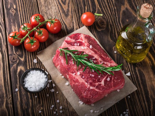 Raw marbled meat steak Ribeye on dark wooden background