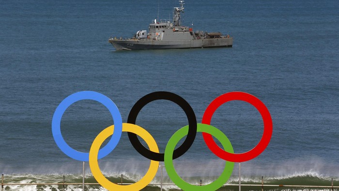 A military ship is seen near the Olympic rings at Copacabana beach in Rio de Janeiro, Brazil August 1, 2016. REUTERS/Nacho Doce TPX IMAGES OF THE DAY