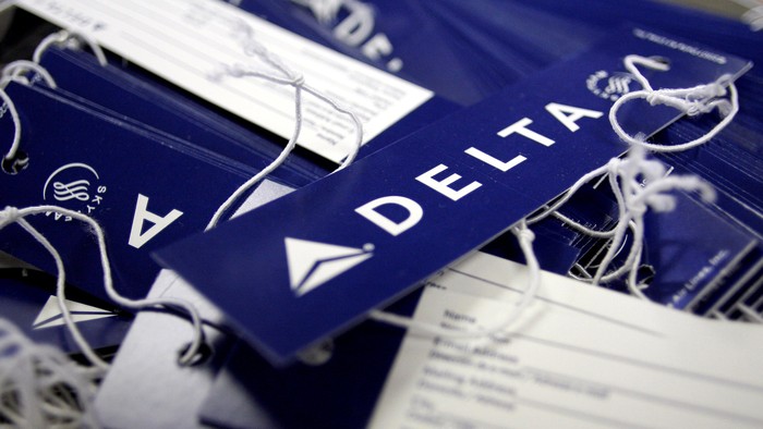 Delta airline name tags are seen at Delta terminal in JFK Airport in New York, July 30, 2008. REUTERS/Joshua Lott/File Photo