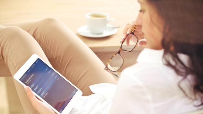 Businesswoman reading information about her bank account on the Internet