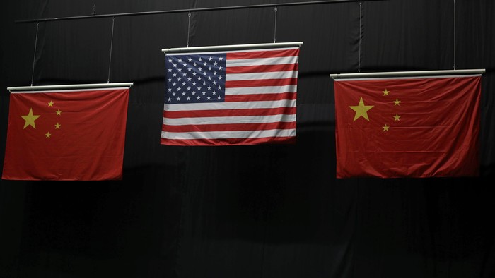 Aug 6, 2016; Rio de Janeiro, Brazil; The American flag flies above the Chinese flags after Virginia Thrasher took the gold medal in the 10m air rifle competition at Olympic Shooting Centre. Mandatory Credit: Geoff Burke-USA TODAY Sports