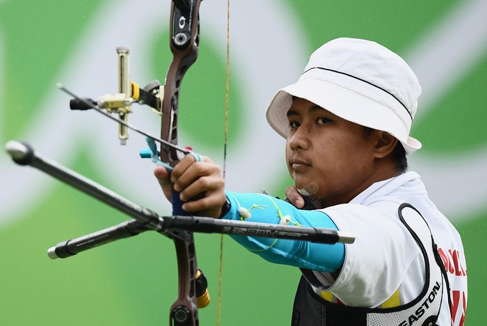 RIO DE JANEIRO, BRAZIL - AUGUST 12: Riau Ega Agatha of Indonesia competes in the Mens Individual round of 8 Elimination Round on Day 7 of the Rio 2016 Olympic Games at the Sambodromo on August 12, 2016 in Rio de Janeiro, Brazil.  (Photo by Matthias Hangst/Getty Images)