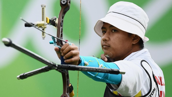 RIO DE JANEIRO, BRAZIL - AUGUST 12: Riau Ega Agatha of Indonesia competes in the Mens Individual round of 8 Elimination Round on Day 7 of the Rio 2016 Olympic Games at the Sambodromo on August 12, 2016 in Rio de Janeiro, Brazil.  (Photo by Matthias Hangst/Getty Images)