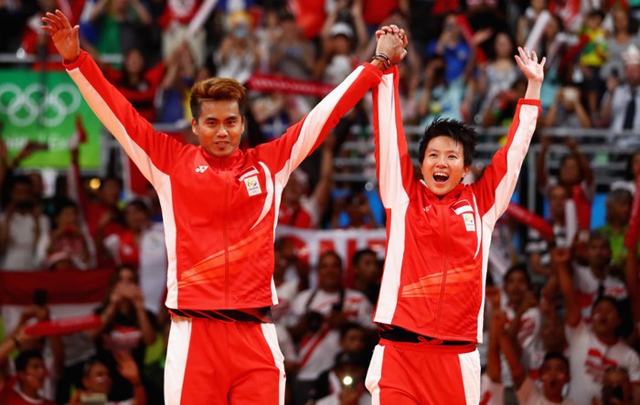 RIO DE JANEIRO, BRAZIL - AUGUST 17: Gold medalists, Tontowi Ahmad and Liliyana Natsir of Indonesia celebrate winning the Mixed Doubles Gold Medal Match against Peng Soon Chan and Liu Ying Goh of Malaysia on Day 12 of the Rio 2016 Olympic Games at Riocentro - Pavilion 4 on August 17, 2016 in Rio de Janeiro, Brazil. (Photo by Dean Mouhtaropoulos/Getty Images)