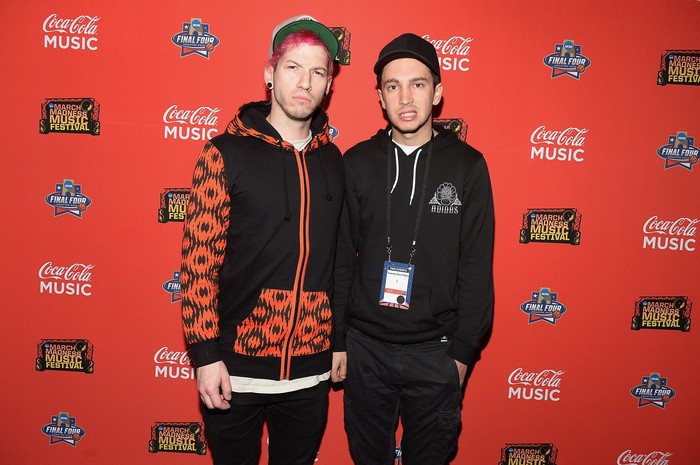 Twenty One Pilots HOUSTON, TEXAS - APRIL 02: Musicians Josh Dun (L) and Tyler Joseph of Twenty One Pilots pose backstage during the Coke Zero Music Mix at the NCAA March Madness Music Festival Day 2 at Discovery Green on April 2, 2016 in Houston, Texas. (Photo by Gustavo Caballero/Getty Images for Turner)