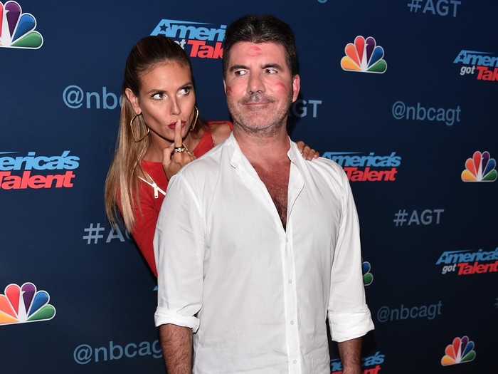 HOLLYWOOD, CA - AUGUST 30:  TV personalities Heidi Klum (rear) and Simon Cowell attend the Americas Got Talent Season 11 Live Show at The Dolby Theatre on August 30, 2016 in Hollywood, California.  (Photo by Alberto E. Rodriguez/Getty Images)