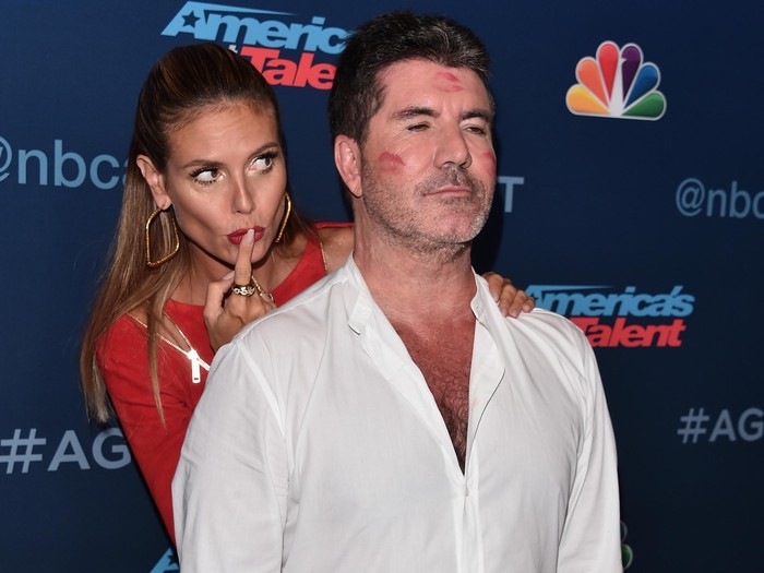 HOLLYWOOD, CA - AUGUST 30:  TV personalities Heidi Klum (rear) and Simon Cowell attend the 