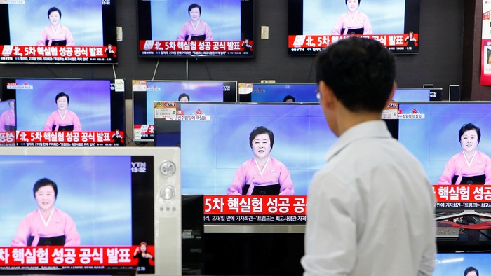 A sales assistant watches TV sets broadcasting a news report on North Koreas fifth nuclear test, in Seoul, South Korea, September 9, 2016.  REUTERS/Kim Hong-Ji