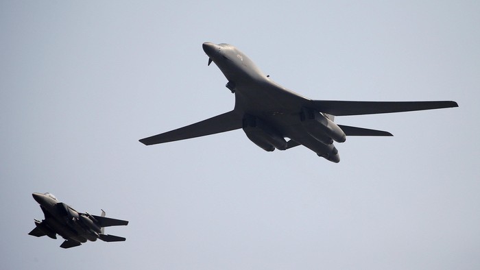 A U.S. Air Force B-1B bomber (R) flies over Osan Air Base in Pyeongtaek, South Korea, September 13, 2016. REUTERS/Kim Hong-Ji