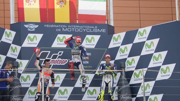 ALCANIZ, SPAIN - SEPTEMBER 27:  Jorge Lorenzo of Spain and Movistar Yamaha MotoGP jumps on the podium at the end of the MotoGP race during the MotoGP of Spain - Race at Motorland Aragon Circuit on September 27, 2015 in Alcaniz, Spain.  (Photo by Mirco Lazzari gp/Getty Images)