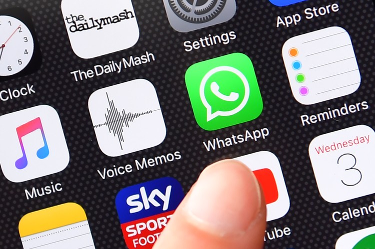 Whatsapp logo LONDON, ENGLAND - AUGUST 03: A persons finger is posed next to the Whatsapp app logo on an iPhone on August 3, 2016 in London, England. (Photo by Carl Court/Getty Images)