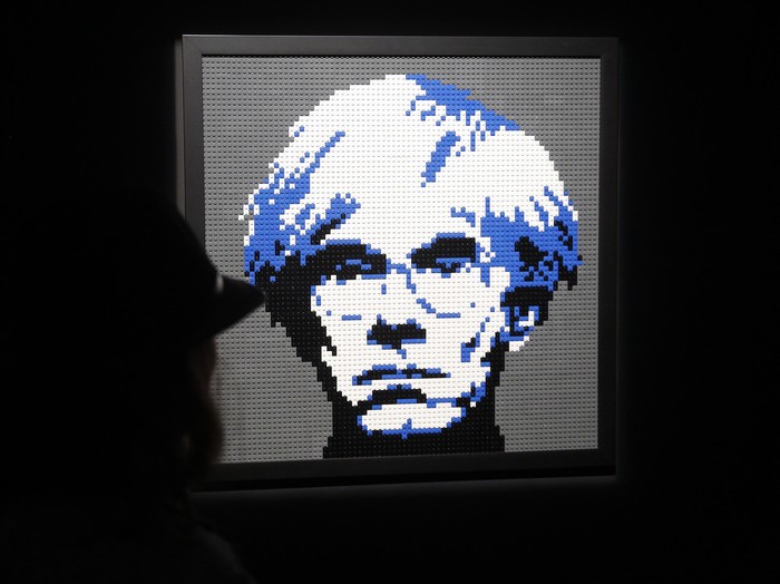Andy Warhol PARIS, FRANCE - MAY 15: A visitor looks at a sculpture showing a portait of Andy Warhol made with Lego bricks by US artist Nathan Sawaya during the exhibition The Art of The Brick on May 15, 2015, in Paris, France. Nathan Sawayas exhibition takes place from May 14 to August 30, 2015. (Photo by Thierry Chesnot/Getty Images)