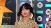 Meski perut semakin membesar, ia tetap terlihat memesona dalam balutan dress bernuansa etnik tersebut. Pool/Ismail/detikFoto.