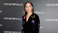 Ia tampil lewat dress mini dan heels berwarna hitam. Pascal Le Segretain/Getty Images/detikFoto.