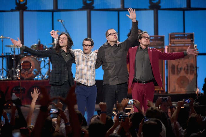 LAS VEGAS, NV - SEPTEMBER 20:  (L-R) Musicians Brian Bell, Rivers Cuomo, Pat Wilson, and Scott Shriner of Weezer perform onstage during the 2014 iHeartRadio Music Festival at the MGM Grand Garden Arena on September 20, 2014 in Las Vegas, Nevada.