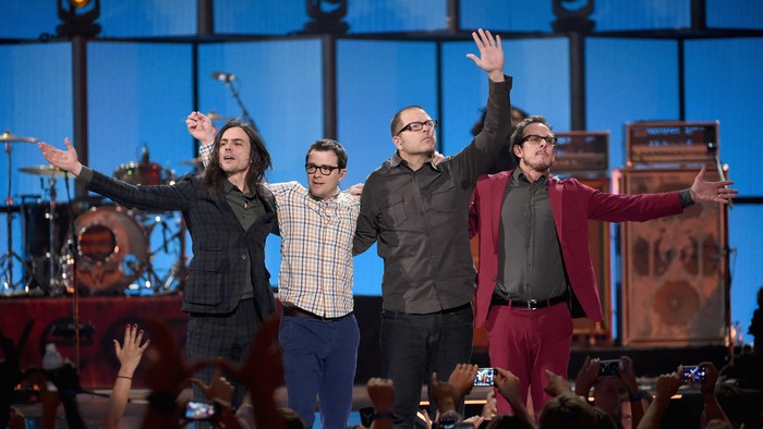 LAS VEGAS, NV - SEPTEMBER 20:  (L-R) Musicians Brian Bell, Rivers Cuomo, Pat Wilson, and Scott Shriner of Weezer perform onstage during the 2014 iHeartRadio Music Festival at the MGM Grand Garden Arena on September 20, 2014 in Las Vegas, Nevada.