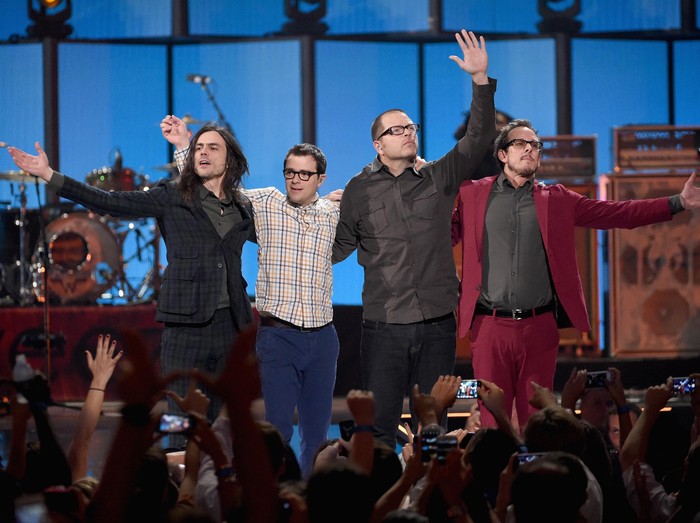 LAS VEGAS, NV - SEPTEMBER 20:  (L-R) Musicians Brian Bell, Rivers Cuomo, Pat Wilson, and Scott Shriner of Weezer perform onstage during the 2014 iHeartRadio Music Festival at the MGM Grand Garden Arena on September 20, 2014 in Las Vegas, Nevada.