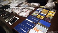 Selain itu 8 buah buku tabungan, kartu ATM, HP dan uang.