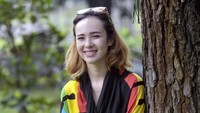 Meski lelah, ia tetap happy saat berpose di depan kamera. Pool/Noel/detikFoto.