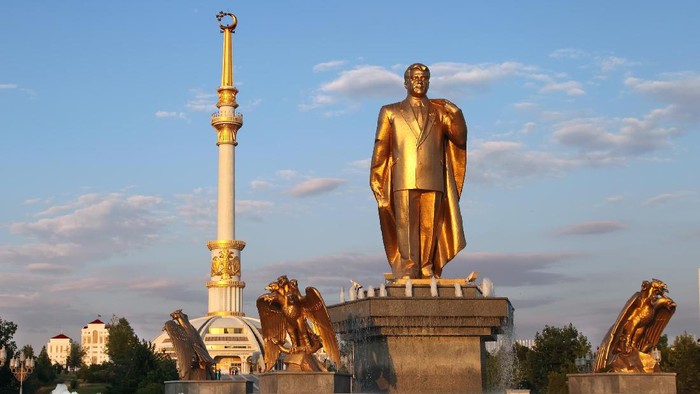 Monumen of Niyazov and Arch of Independence in sunset. Ashkhabad. Turkmenistan.