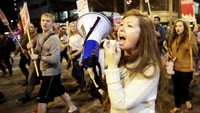 Mereka yang ikut aksi protes ini merasakan ketakutan soal masa depan AS di bawah kepemimpinan Trump selama 4 tahun ke depan. REUTERS/David Becker.